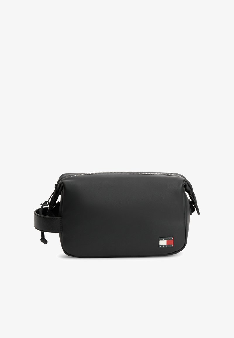 Μαύρο ορθογώνιο νεσεσέρ με πλαϊνή λουρίδα και φερμουάρ στην κορυφή, με μικρό λογότυπο Tommy Jeans στο μπροστινό κάτω δεξί μέρος.