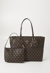 Black tote bag with gold logo pattern, featuring two handles, accompanied by a smaller matching pouch with a zipper and logo detail.