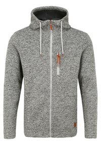 Gray zip-up hoodie in a textured, knit material. Features a drawstring hood, contrasting white zipper, and leather accent on the hem.