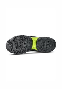 Black athletic shoe sole with deep treads, featuring a textured grip pattern and a neon green accent in the midsole for added support.
