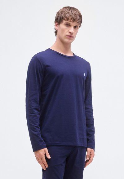 T-shirt de manga comprida azul-marinho em tecido macio e elástico, com gola redonda e pequena borda de logotipo no peito.