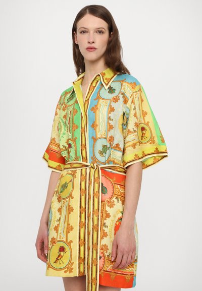 Short-sleeve shirt dress in bright colors (yellow, green, orange, blue) featuring ornate patterns and a cinched waist with a matching belt.