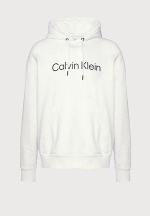 Fehér kapucnis felső, puha anyagból készült, elülső zsebbel, húzózsinórral ellátott kapucnival és fekete "Calvin Klein" logóval a mellkason.