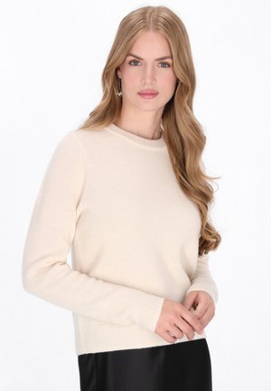 Maglione a maglia color crema con maniche lunghe, scollatura tonda e polsini e orlo a coste. Texture morbida e design aderente.