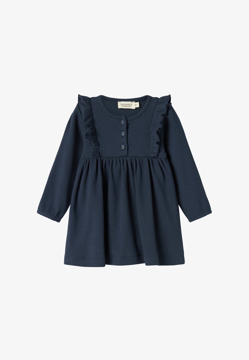 La dressin sinine kotiri, millel on voltitud õlavarre ja neli nuppu ees. Pehme sooniktekstuur ja lõtv seelik.