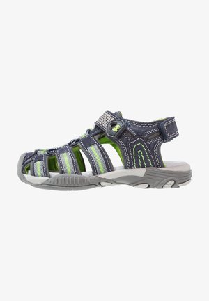 Sandale bleue et verte au design ouvert, avec dessus synthétique, talon rembourré, semelle en caoutchouc et fermeture réglable pour un ajustement optimal.
