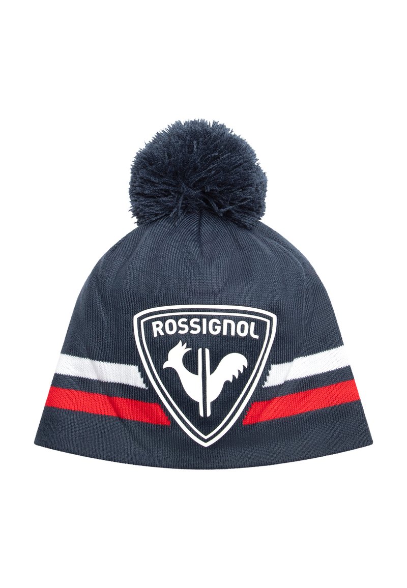 Námornícky pletený kulich s bambulí na vrchu; obsahuje bílý a červený pruhovaný pás a centrální logo s siluetou kohouta.