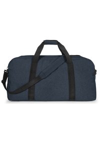 Gran bolsa de lona marina de gran tamaño hecha de un tejido texturizado, con asas negras y una correa de hombro extraíble para opciones de transporte versátiles.