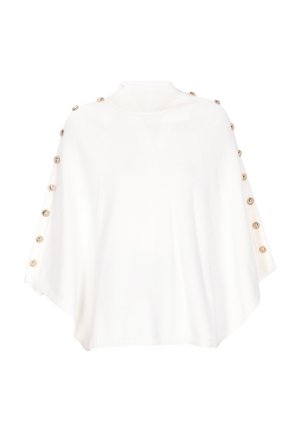 Hvid strikket poncho med høj krave, der har dekorerende guldknapper langs skuldrene og et flydende, tekstureret design.