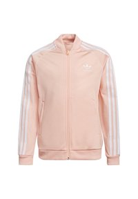 Chaqueta de cremallera rosa claro hecha de un tejido suave. Presenta tres líneas blancas en las mangas y un pequeño logo en el pecho. Puños acanalados.