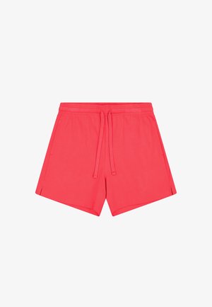 Pantalones cortos color coral hechos de tejido suave, con una cinturilla elástica y cordón, aberturas laterales y un diseño relajado.