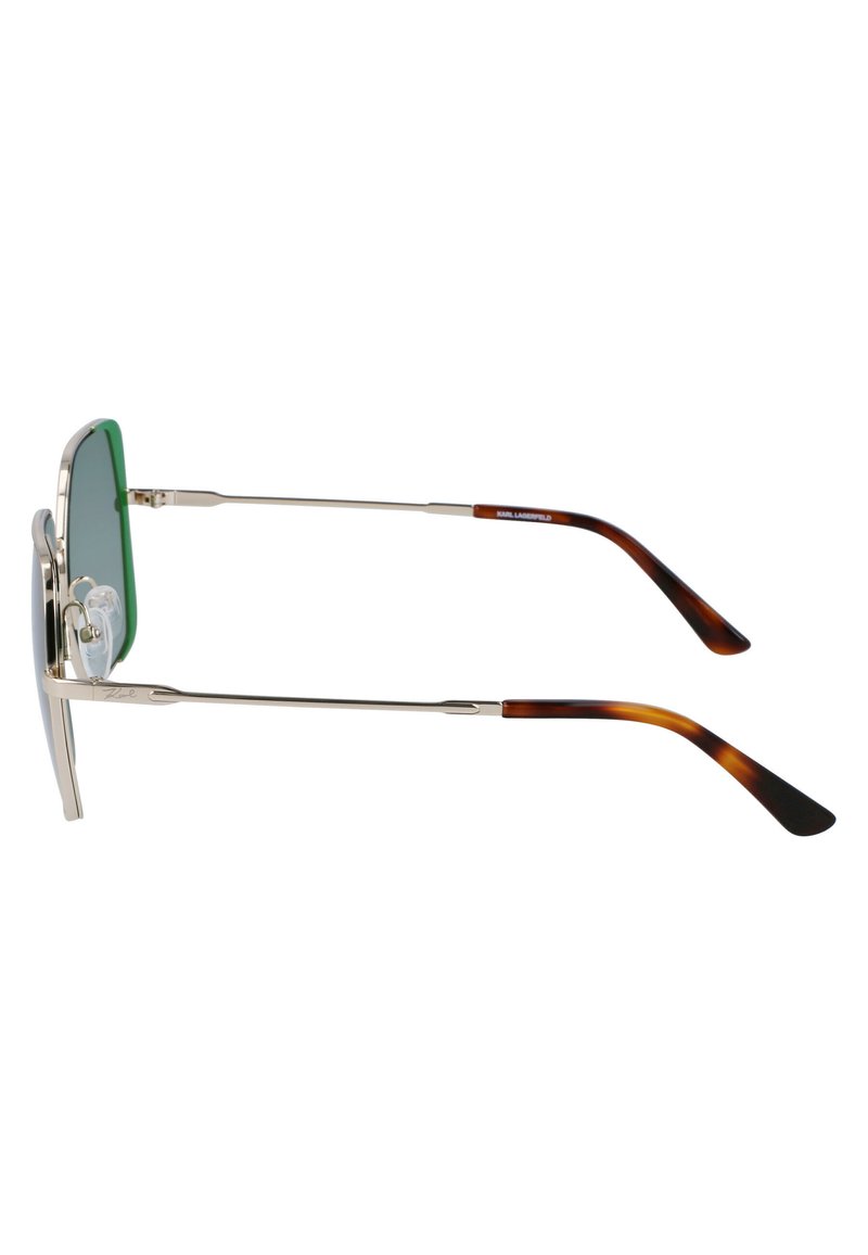 Occhiali da sole con lenti verde chiaro, montatura in metallo argentato e aste in acetato tartarugato. Presentano cuscinetti nasali per comfort e vestibilità regolabile.
