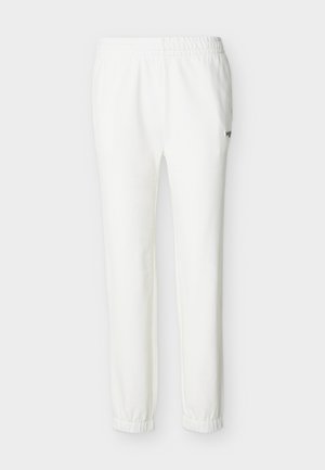 Pantalon de jogging blanc décontracté avec taille et chevilles élastiques, doté d'un petit logo brodé sur la cuisse supérieure.