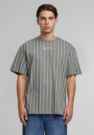 Gray t-shirt with white vertical stripes, short sleeves, and a round neckline. Features a small signature detail on the front.