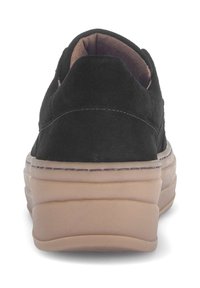 Black suede slip-on shoe with a rounded back and thick light-colored rubber sole, featuring visible stitching along the edges.