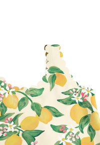 Lillelille mustriga kangas, millel on kollased sidrunid ja valged lilled heledal taustal, ning krae ääres on laineline äär.