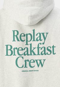 Gray hoodie featuring a large green print that reads "Replay Breakfast Crew" with the text "ORIGINAL DENIM GOODS" below.