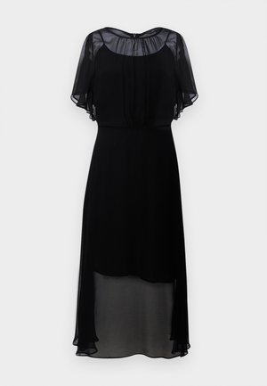 Fekete ruha rövid, áttetsző fodros ujjakból, kerek nyakkivágással és térd alatti, lágyan hullámzó szoknyával. Könnyű, áttetsző anyag.