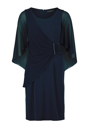 Abito blu navy con maniche a campana trasparenti, dettagli drappeggiati e un accento arricciato in vita con sottili decorazioni. Chiusura con zip sul retro.