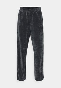 TIRO - Tracksuit bottoms - black