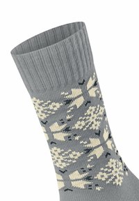 Calza in nylon grigia con bordo a coste, caratterizzata da un motivo geometrico di alberi e forme in crema e nero su tutta la superficie.
