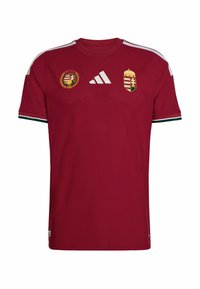 Maillot de football rouge foncé avec logo Adidas blanc, écusson de l'équipe nationale de Hongrie et badge du 125e anniversaire sur la poitrine, bandes blanches sur les épaules.