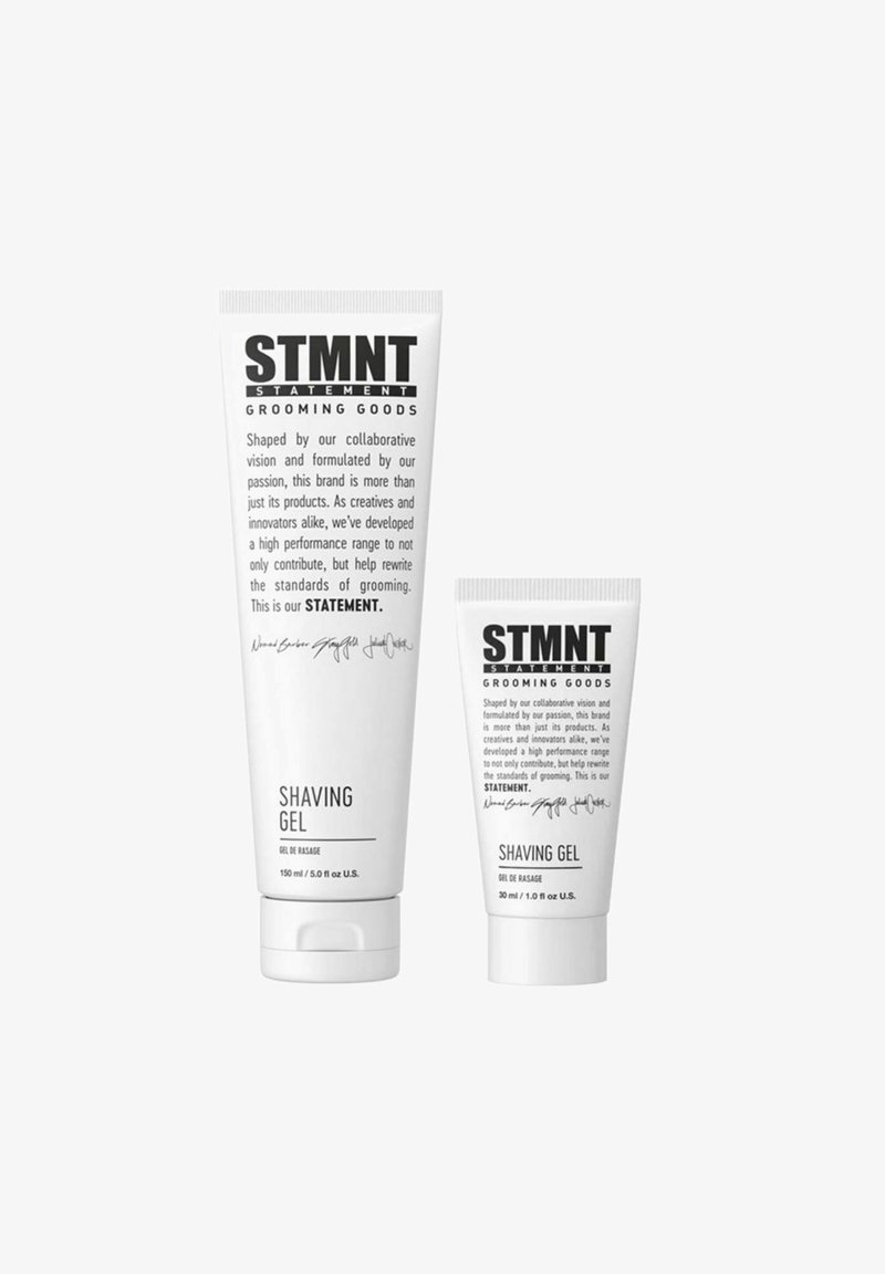 Two white tubes of STMTN Shaving Gel, one large (150 ml) and one small (30 ml), featuring minimalist black text and simple designs.
