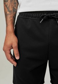 Next REGULAR FIT - Tepláky - black