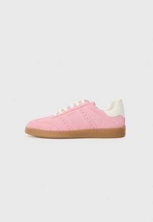 Pink suede sneaker with white accents, rubber sole, and perforated stripes. Features laces and a curved back, designed for casual wear.