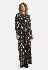 Black long-sleeve dress with a wrap design, featuring a floral pattern in cream and pink. Includes a tied waist detail and wide leg fit.
