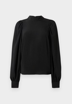 Juoda ilgo rankovėmis bluzonė su aukštu kaklu, pūstomis petnešomis ir prisiūtomis rankovėmis, eksponuojama ant balto fono.