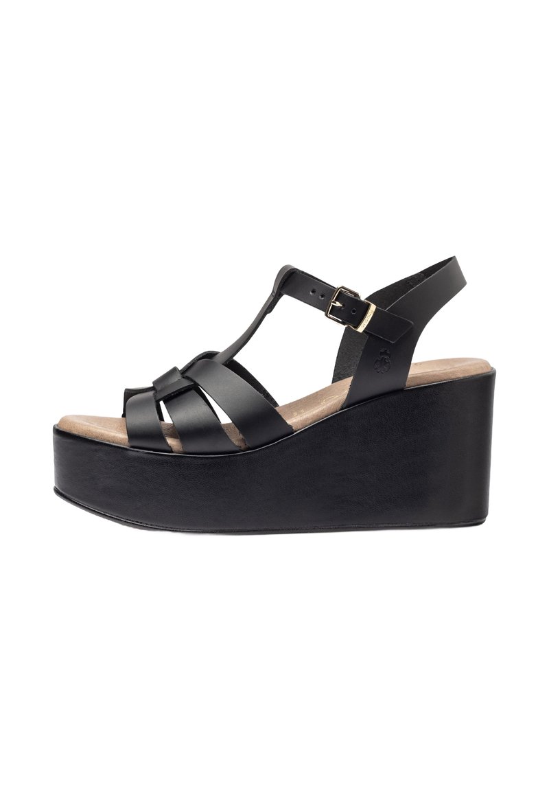 Sandale compensée noire avec un design de plateforme, plusieurs sangles en cuir, une sangle à la cheville avec une boucle et une semelle texturée.