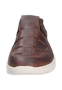 Brown leather shoe with woven design on the upper, round toe, and white rubber sole. Flat vamp and subtle stitching details throughout.