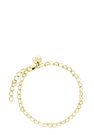 Pulsera de oro con elementos en forma de corazón enlazados, un cierre de langosta y una cadena ajustable. Incluye una etiqueta redonda con la marca.