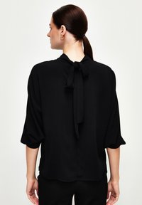 adL RUFFLED COLLOR GÜMPED - Camicetta - black