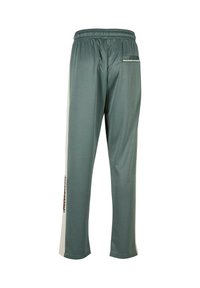 Grüne Sporthose mit elastischem Bund, seitlichen Streifen und einer kleinen Gesäßtasche. Weicher Stoff mit lockerer Passform und geradem Schnitt.