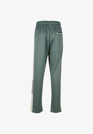 Rohelised sportlikud püksid elastse vöökoha, külgtriipude ja väikese tagataskuga. Pehme tekstuur, lõdva lõikega ja sirgete jalgade disain.