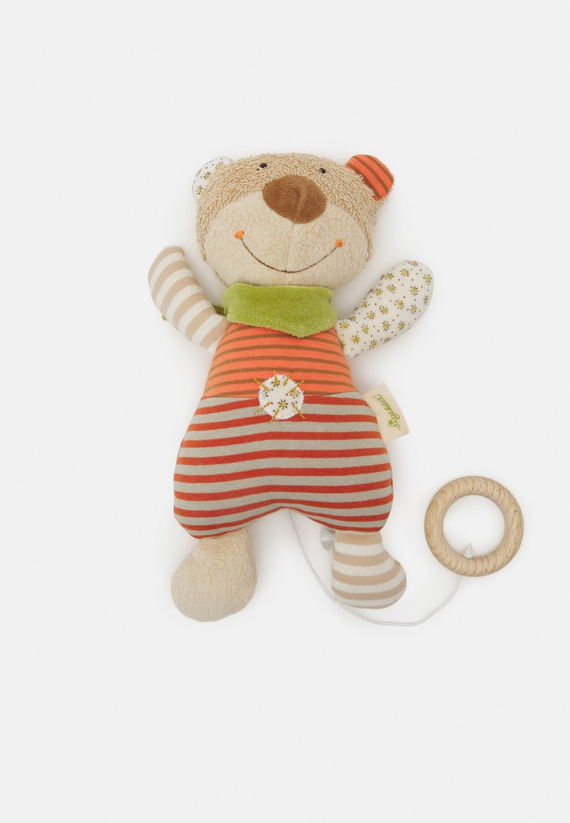 Stuffed bear toy with beige fabric, striped orange and gray overalls, green scarf, floral-patterned ears, and wooden teething ring attached.