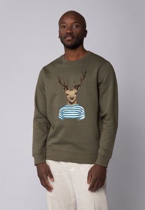 Green sweatshirt featuring a deer with antlers wearing a blue and white striped shirt, displayed against a light gray background.