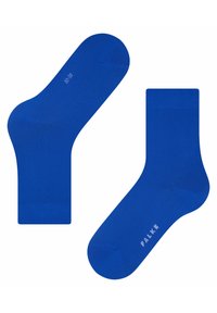 Calze in cotone blu con una texture liscia, design alla caviglia e taglia contrassegnata di 32-38. Nome del marchio "FALKE" stampato in bianco.