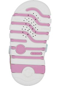 Suela de zapato de goma blanca con acentos rosas, presenta patrones texturizados, agujeros de ventilación y está marcada con 'GEOX' y 'SUAVEMENTE AMORTIGUADA'.