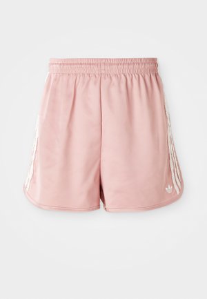 Calções de desporto cor-de-rosa com uma cintura elástica, detalhes de uma faixa branca lateral e um pequeno logótipo na parte inferior esquerda da frente. Textura de tecido suave.