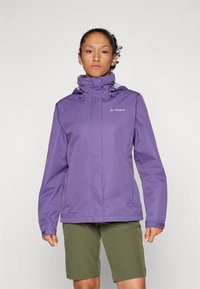 Purple waterproof jacket with adjustable hood, zip pockets, and ventilation details. Paired with green shorts for outdoor wear.