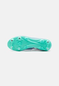 Football cleat with a textured turquoise outsole, featuring circular studs and a mesh upper in blue and pink accents.