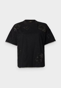 T-shirt nera a maniche corte con decorazioni testurizzate, dotata di scollatura rotonda e orlo grezzo alle maniche, realizzata in tessuto morbido.
