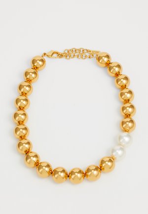 Gold-tone bead necklace with two white pearl beads near the clasp and an adjustable chain closure on a white background.