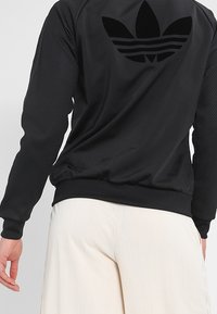 adidas Originals Tröja med dragkedja - black