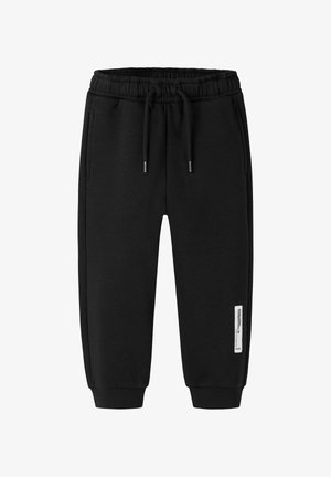 Black sweatpants made of soft cotton blend, featuring an elastic waistband with drawstrings, side pockets, and cuffed ankles.