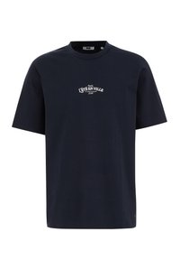 Körpernahe, navyblaue Baumwoll-T-Shirt mit entspanntem Schnitt, kurzen Ärmeln, Rundhalsausschnitt und weißem Aufdruck mit dem Schriftzug „L’ÉTÉ EN VILLE“ auf der Vorderseite.