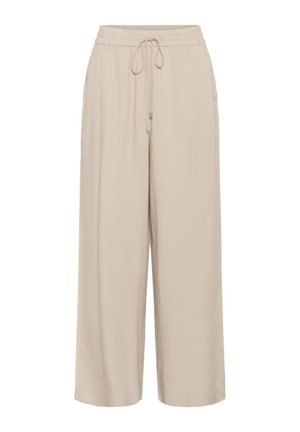 Pantalon beige à jambes larges avec ceinture élastique et cordon de serrage, poches latérales et coupe décontractée.